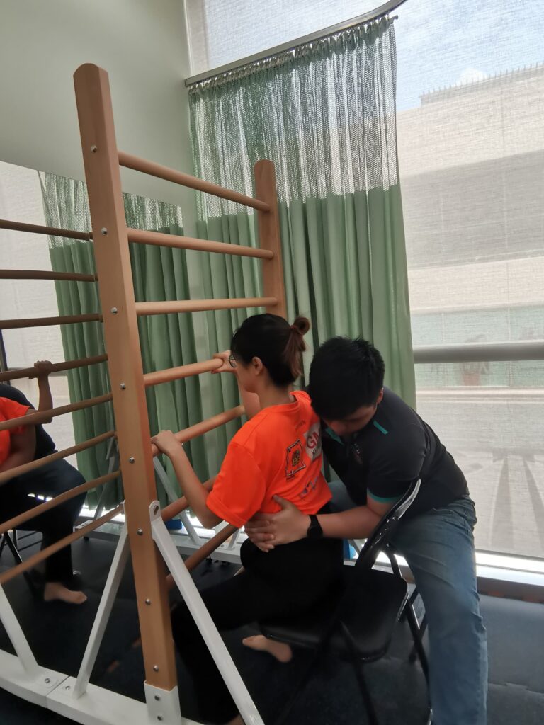 Patient perform Schroth Method Exercise, Therapist guiding